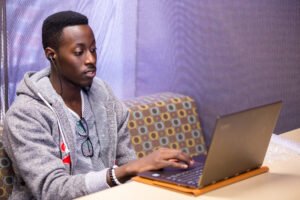 ĵֱ Master of Science in Information Science student working on his laptop